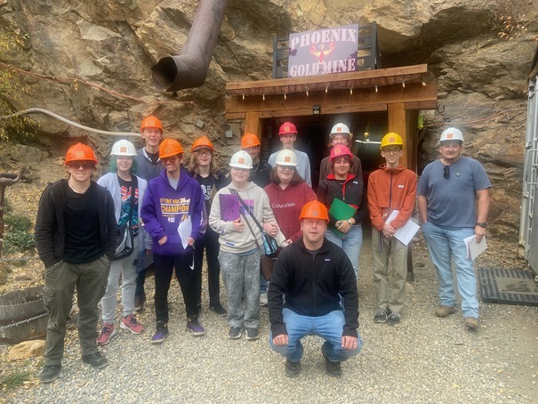 People in front of a mine